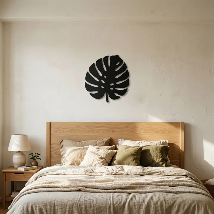 Monstera leaf steel wall art in a bedroom
